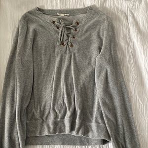 Grey crew neck sweater with front lacing
